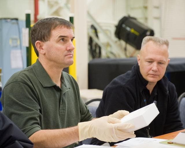 NASA image: STS-335 crew training, EVA TPS Overview with instructor John Ray    