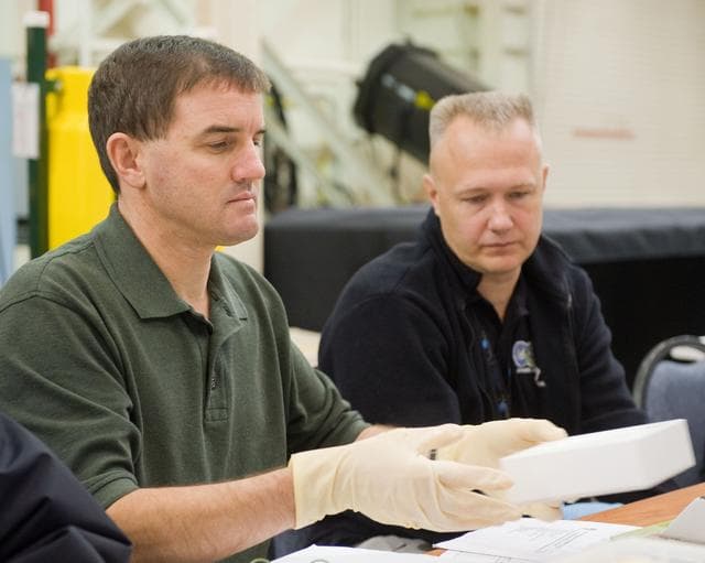NASA image: STS-335 crew training, EVA TPS Overview with instructor John Ray    