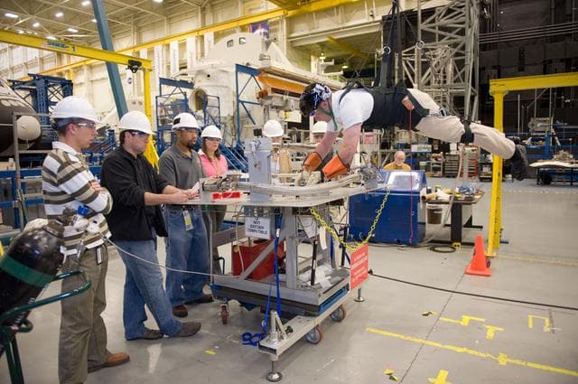 NASA image: STS134 crew during EVA PGT POGO and EVA 1 tag up with instructors Allison Bolinger and Vicky Otto.    