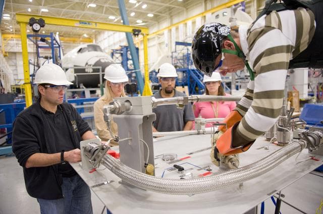 NASA image: STS134 crew during EVA PGT POGO and EVA 1 tag up with instructors Allison Bolinger and Vicky Otto.    