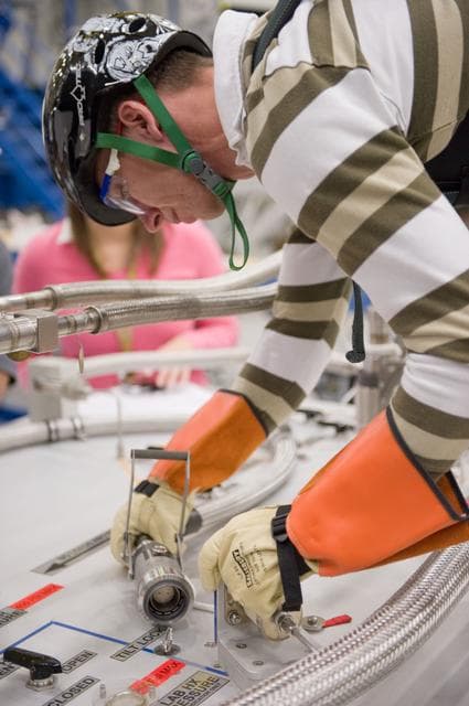 NASA image: STS134 crew during EVA PGT POGO and EVA 1 tag up with instructors Allison Bolinger and Vicky Otto.    