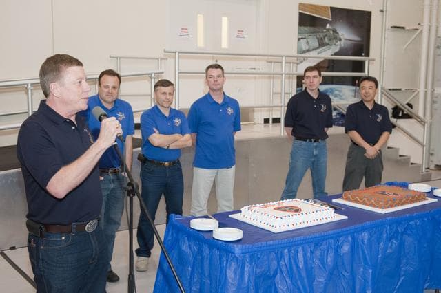 NASA image: Expedition 27/28 Cake Cutting Ceremony in building 5 high bay