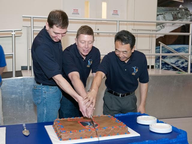 NASA image: Expedition 27/28 Cake Cutting Ceremony in building 5 high bay