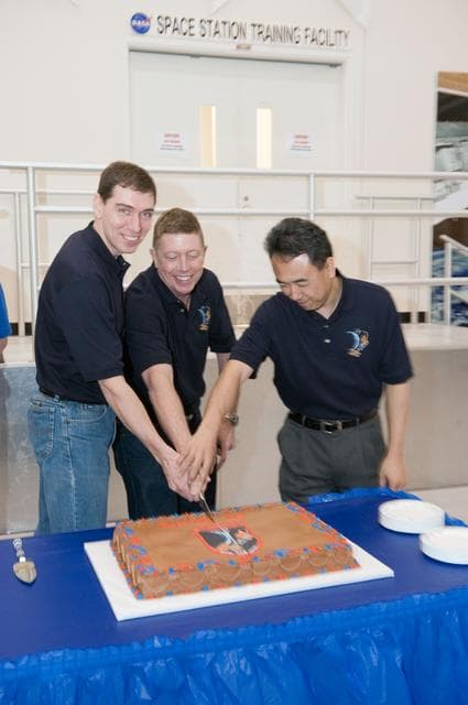 NASA image: Expedition 27/28 Cake Cutting Ceremony in building 5 high bay