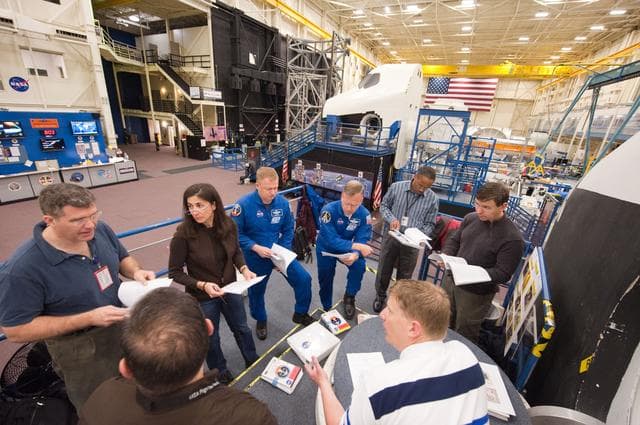 NASA image: STS-133 crew during their photo/TV training with instructor Gary Kilgo.  