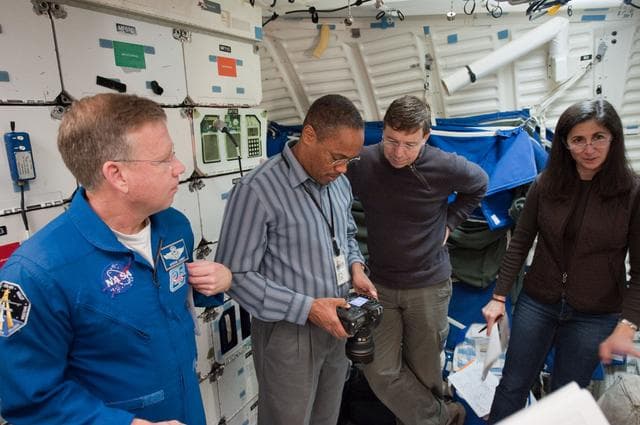 NASA image: STS-133 crew during their photo/TV training with instructor Gary Kilgo.  