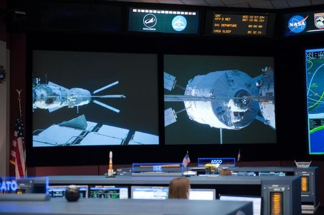 NASA image: ISS Orbit 2 flight controllers on console with Flight Director Bob Dempsey    