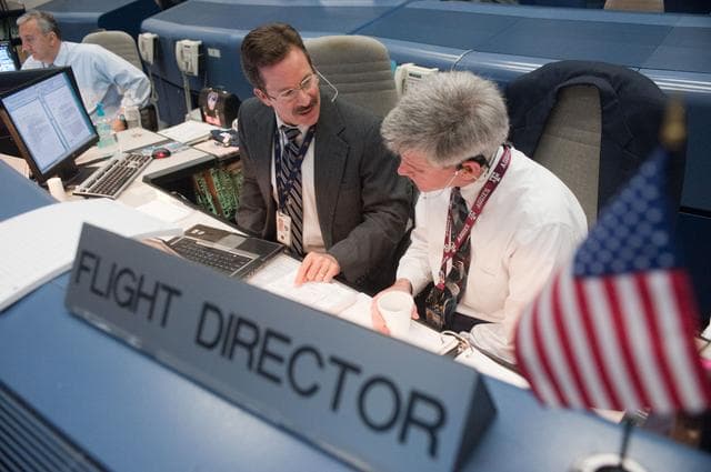 NASA image: STS-133/ULF5 Flight Controllers on Console - Orbit Shift 3/1