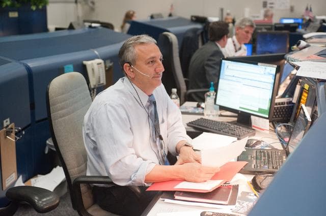 NASA image: STS-133/ULF5 Flight Controllers on Console - Orbit Shift 3/1