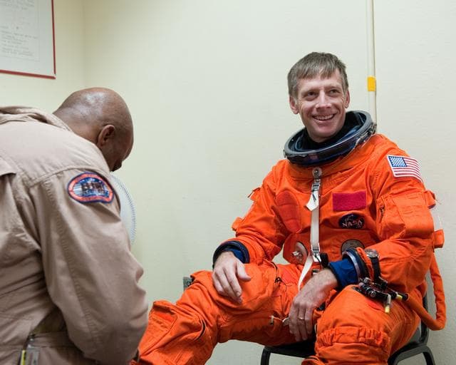 NASA image: STS-135 Crew during prep and insertion into Fixed Base Simulator     