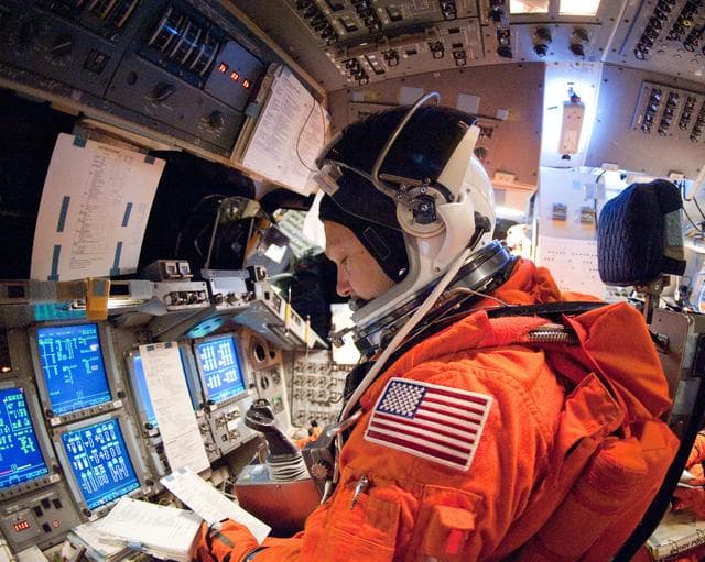 NASA image: STS-135 Crew during prep and insertion into Fixed Base Simulator     