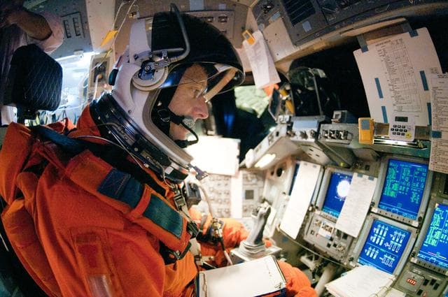 NASA image: STS-135 Crew during prep and insertion into Fixed Base Simulator     