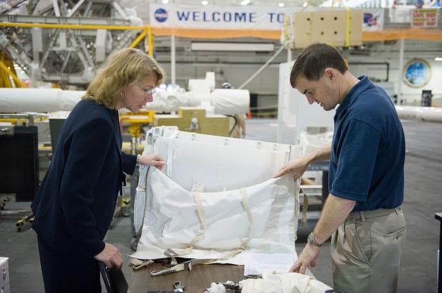 NASA image: STS-135 crew members Rex Walheim and Sandra Magnus during EVA TPS OPS at 1G Trainer at the NBL.