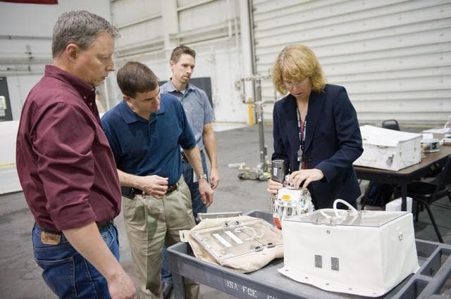 NASA image: STS-135 crew members Rex Walheim and Sandra Magnus during EVA TPS OPS at 1G Trainer at the NBL.