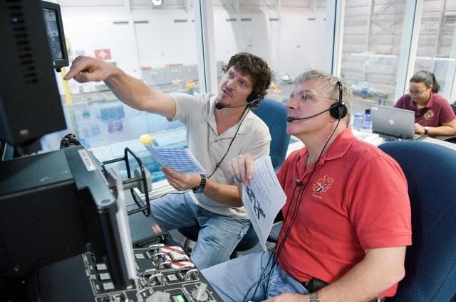 NASA image: STS-134 crew members Michael Fincke and Greg Chamitoff during their final EVA4 training run at the NBL. 