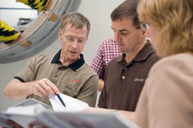 NASA image: STS-135 crew during Ingress/Egress Timeline training in building 9NW space station mockups    