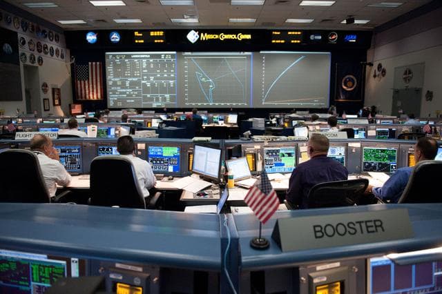 NASA image: STS-134 Flight Controllers on Console - Launch. Flight Director: Richard Jones    