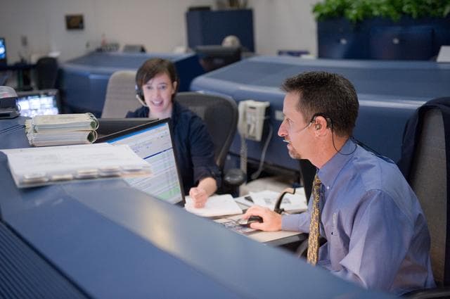 NASA image: STS-134 Orbit 1 flight controllers on console during AMS install 