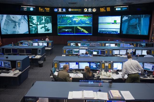 NASA image: STS-134 Orbit 1 flight controllers on console during AMS install 