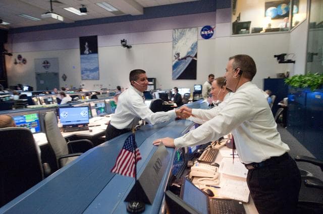 NASA image: STS135 flight controllers on console during last shuttle mission