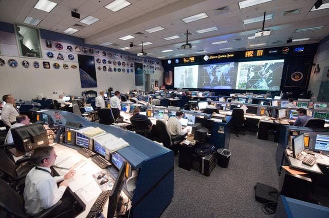 NASA image: STS135 flight controllers on console during last shuttle mission