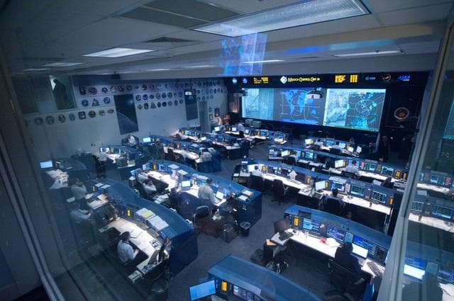 NASA image: STS135 flight controllers on console during last shuttle mission