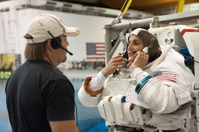 NASA image: Expedition 32 crew members Suni Williams and Aki Hoshide conduct pre-test briefings