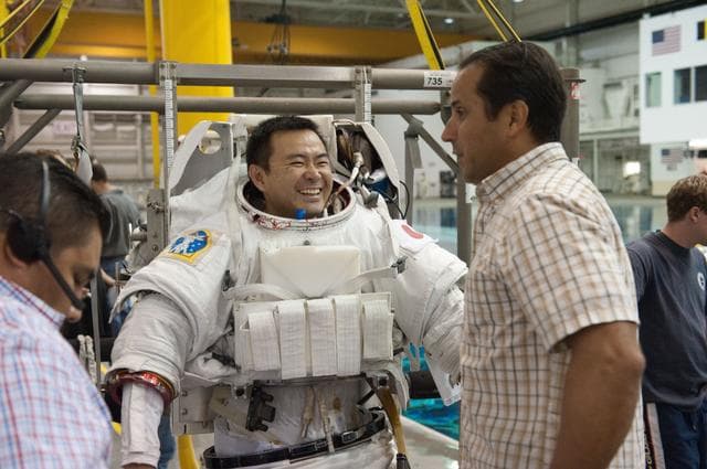 NASA image: Expedition 32 crew members Suni Williams and Aki Hoshide conduct pre-test briefings
