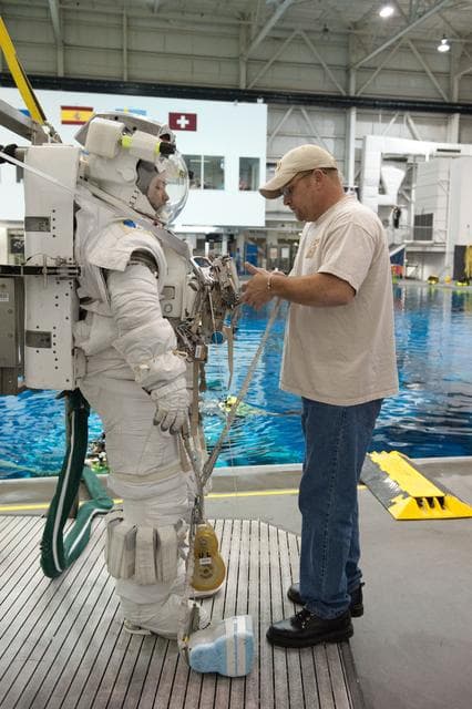 NASA image: Expedition 32 crew members Suni Williams and Aki Hoshide conduct pre-test briefings