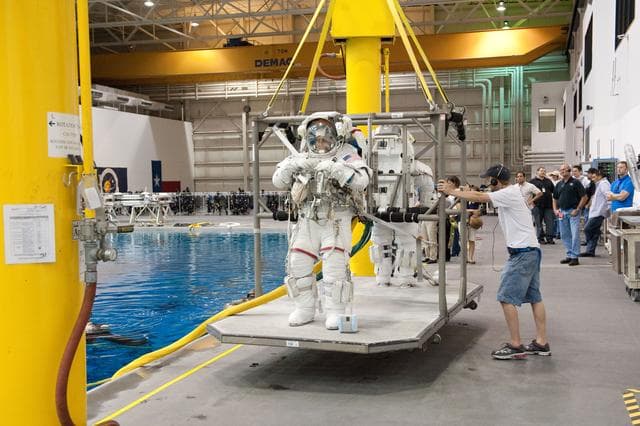 NASA image: Expedition 32 crew members Suni Williams and Aki Hoshide conduct pre-test briefings