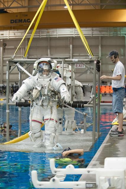 NASA image: Expedition 32 crew members Suni Williams and Aki Hoshide conduct pre-test briefings