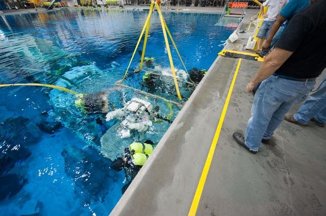 NASA image: Expedition 32 crew members Suni Williams and Aki Hoshide conduct pre-test briefings