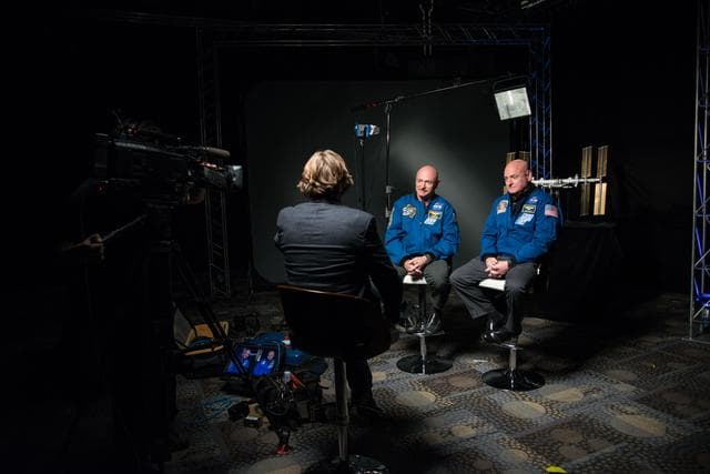 NASA image: Mark and Scott Kelly talk to news media