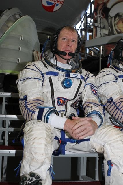 NASA image: CG4G8784 --- (6 May 2015) --- At the Gagarin Cosmonaut Training Center in Star City, Russia, Expedition 44/45 backup Flight Engineer Timothy Peake of the European Space Agency answers questions from reporters in front of a Soyuz spacecraft simulator May 6 as part of his final qualification exams for flight. He along with Yuri Malenchenko of the Russian Federal Space Agency (Roscosmos) and Timothy Kopra of NASA (not pictured) are the backups to the prime crew --- Kjell Lindgren of NASA, Oleg Kononenko of Roscosmos and Kimya Yui of the Japan Aerospace Exploration Agency --- who are in the final stages of training for launch May 27, Kazakh time, in the Soyuz TMA-17M spacecraft to begin a five and a half month mission to the International Space Station. Photo credit: NASA/Seth Marcantel