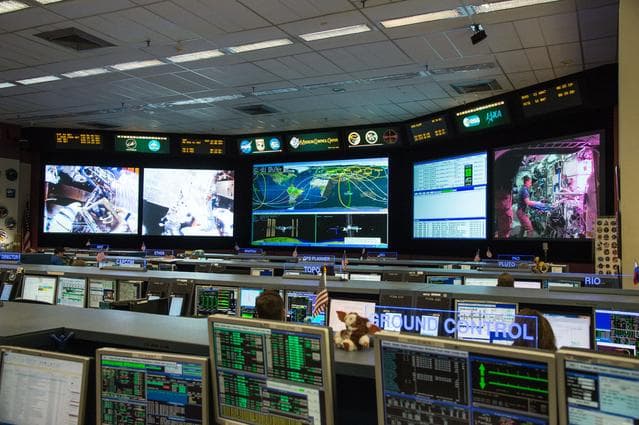 NASA image: PHOTO DATE: 08-10-15.LOCATION:  Bldg. 30 - FCR-1 (30M/231).SUBJECT: Expedition 44, Kjell Lindgren.Kimiya Yui AND SCOTT KELLY TASTING SPACE LETTUCE EXPERIMENT.PHOTOGRAPHER:  BILL STAFFORD