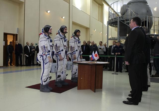 NASA image: At the Gagarin Cosmonaut Training Center in Star City, Russia, Expedition 46-47 backup crewmembers Kate Rubins of NASA (left), Anatoly Ivanishin of the Russian Federal Space Agency (Roscosmos, center) and Takuya Onishi of the Japan Aerospace Exploration Agency (right) check in with Russian space officials Nov. 19 prior to their qualification exams. They are the backups to the prime crewmembers, Yuri Malenchenko of Roscosmos, Tim Kopra of NASA and Tim Peake of the European Space Agency, who will launch Dec. 15 in the Soyuz TMA-19M spacecraft from the Baikonur Cosmodrome in Kazakhstan for a six-month mission on the International Space Station..NASA/Seth Marcantel