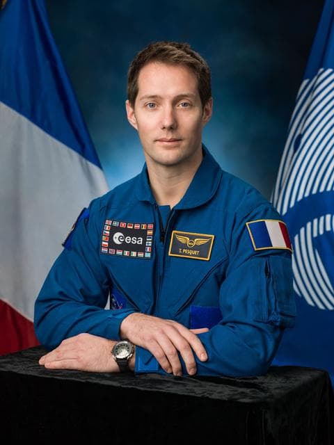 NASA image: PHOTO DATE: 01-14-16.LOCATION: Bldg. 8, Room 183 - Photo Studio.SUBJECT: Official portrait of ESA astronaut & Expedition 50/51 crew member Thomas Pesquet in blue flight suit..PHOTOGRAPHER: BILL STAFFORD