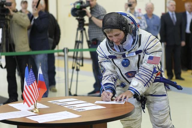 NASA image: At the Gagarin Cosmonaut Training Center in Star City, Russia, Expedition 48-49 backup crewmember Peggy Whitson of NASA signs in for Soyuz qualification exams May 26. Whitson, Thomas Pesquet of the European Space Agency and Oleg Novitskiy of Roscosmos are serving as the backups to prime crewmembers Kate Rubins of NASA, Takuya Onishi of the Japan Aerospace Exploration Agency and Anatoly Ivanishin of Roscosmos, who will launch June 24 on the Soyuz MS-01 spacecraft from the Baikonur Cosmodrome in Kazakhstan for a four-month mission on the International Space Station...NASA/Stephanie Stoll.