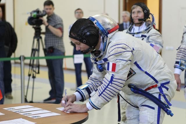 NASA image: At the Gagarin Cosmonaut Training Center in Star City, Russia, Expedition 48-49 backup crewmember Thomas Pesquet of the European Space Agency signs in for Soyuz qualification exams May 26. Pesquet, Peggy Whitson of NASA and Oleg Novitskiy of Roscosmos are serving as the backups to prime crewmembers Kate Rubins of NASA, Takuya Onishi of the Japan Aerospace Exploration Agency and Anatoly Ivanishin of Roscosmos, who will launch June 24 on the Soyuz MS-01 spacecraft from the Baikonur Cosmodrome in Kazakhstan for a four-month mission on the International Space Station...NASA/Stephanie Stoll.