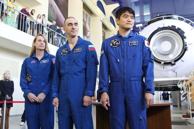 NASA image: At the Gagarin Cosmonaut Training Center in Star City, Russia, Expedition 48-49 prime crewmembers Kate Rubins of NASA (left), Anatoly Ivanishin of Roscosmos (center) and Takuya Onishi of the Japan Aerospace Exploration Agency (right) pose for pictures May 26 during a final qualification exam session. Rubins, Onishi and Ivanishin will launch June 24 on the Soyuz MS-01 spacecraft from the Baikonur Cosmodrome in Kazakhstan for a four-month mission on the International Space Station...NASA/Stephanie Stoll.