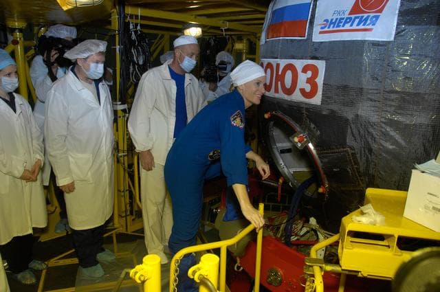 NASA image: In the Integration Facility at the Baikonur Cosmodrome in Kazakhstan, Expedition 48-49 crewmember Kate Rubins of NASA climbs aboard the Soyuz MS-01 spacecraft June 25 for a �ޔfit check��� dress rehearsal activity. Rubins, Anatoly Ivanishin of Roscosmos and Takuya Onishi of the Japan Aerospace Exploration Agency will launch on July 7, Baikonur time, on the Soyuz MS-01 for a planned four-month mission on the International Space Station...NASA/Alexander Vysotsky.