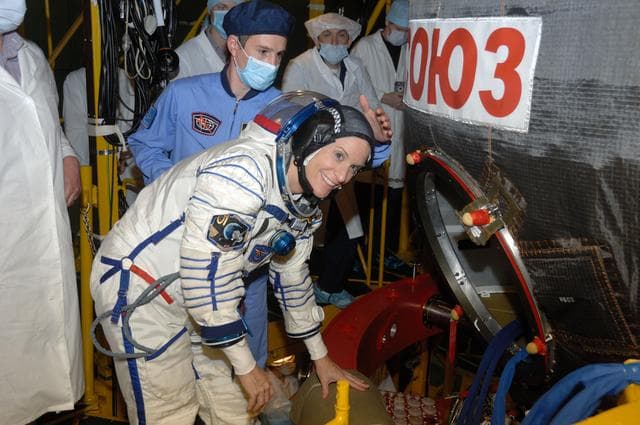 NASA image: In the Integration Facility at the Baikonur Cosmodrome in Kazakhstan, Expedition 48-49 crewmember Kate Rubins of NASA climbs aboard the Soyuz MS-01 spacecraft June 25 for a �ޔfit check��� dress rehearsal activity. Rubins, Anatoly Ivanishin of Roscosmos and Takuya Onishi of the Japan Aerospace Exploration Agency will launch on July 7, Baikonur time, on the Soyuz MS-01 spacecraft for a planned four-month mission on the International Space Station...NASA/Alexander Vysotsky.