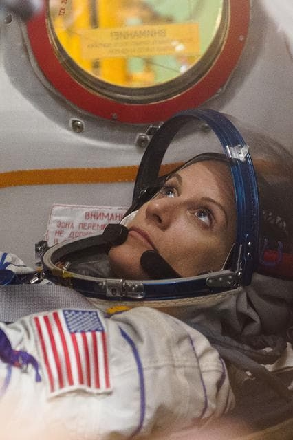 NASA image: In the Integration Facility at the Baikonur Cosmodrome in Kazakhstan, Expedition 48-49 crewmember Kate Rubins of NASA conducts a �ޔfit check��� familiarization aboard the Soyuz MS-01 spacecraft June 25 as part of the preparations for launch with Anatoly Ivanishin of Roscosmos and Takuya Onishi of the Japan Aerospace Exploration Agency on July 7, Baikonur time for a planned four-month mission on the International Space Station...GCTC/Andrei Shelepin.