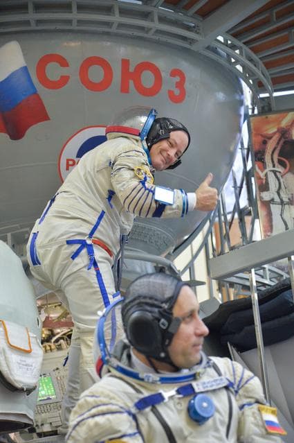 NASA image: jsc2017e135200 - At the Gagarin Cosmonaut Training Center in Star City, Russia, Expedition 54-55 prime crewmember Scott Tingle of NASA flashes a thumbs up as he boards a Soyuz spacecraft simulator Nov. 29 as part of the crew’s final qualification exam a