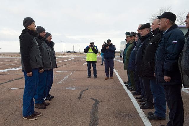 NASA image: jsc2017e136099 - Expedition 54-55 crewmembers Norishige Kanai of the Japan Aerospace Exploration Agency (JAXA, left), Anton Shkaplerov of the Russian Federal Space Agency (Roscosmos, center) and Scott Tingle of NASA report to Russian space officials upon 