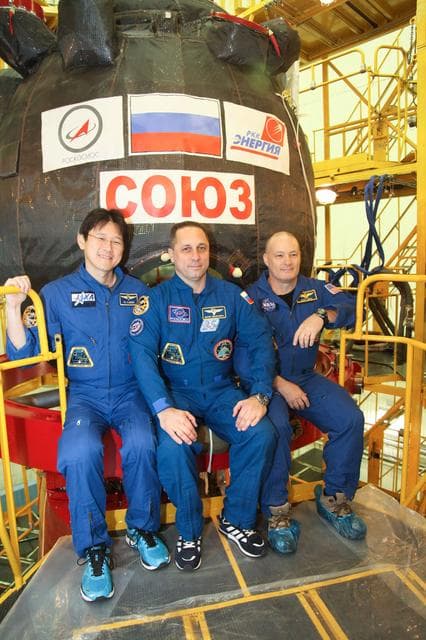 NASA image: jsc2017e136448 - In the Integration Facility at the Baikonur Cosmodrome in Kazakhstan, Expedition 54-55 crewmembers Norishige Kanai of the Japan Aerospace Exploration Agency (JAXA, left), Anton Shkaplerov of the Russian Federal Space Agency (Roscosmos, ce