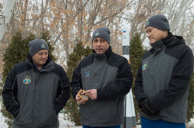NASA image: jsc2017e137333 - At their Cosmonaut Hotel crew quarters in Baikonur, Kazakhstan, Expedition 54-55 prime crewmembers Scott Tingle of NASA (left), Anton Shkaplerov of the Russian Federal Space Agency (Roscosmos, center) and Norishige Kanai of the Japan Aero