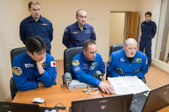 NASA image: jsc2017e137334 - At their Cosmonaut Hotel crew quarters in Baikonur, Kazakhstan, Expedition 54-55 prime crewmembers Norishige Kanai of the Japan Aerospace Exploration Agency (JAXA, left), Anton Shkaplerov of the Russian Federal Space Agency (Roscosmos, ce