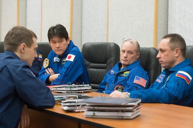 NASA image: jsc2017e137335 - At their Cosmonaut Hotel crew quarters in Baikonur, Kazakhstan, Expedition 54-55 prime crewmembers Norishige Kanai of the Japan Aerospace Exploration Agency (JAXA, left), Scott Tingle of NASA (center) and Anton Shkaplerov of the Russian F