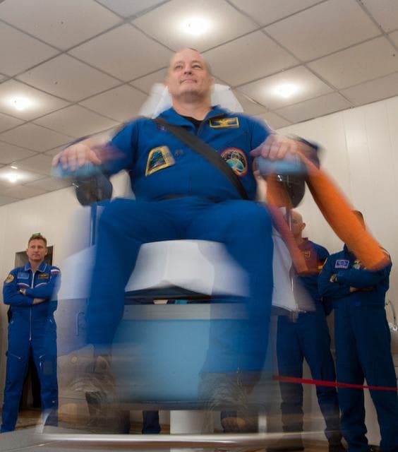 NASA image: jsc2017e137339 - At the Cosmonaut Hotel crew quarters in Baikonur, Kazakhstan, Expedition 54-55 prime crewmember Scott Tingle of NASA tests his vestibular skills on a rotating chair Dec. 11 as part of his pre-launch training. Tingle, Norishige Kanai of th